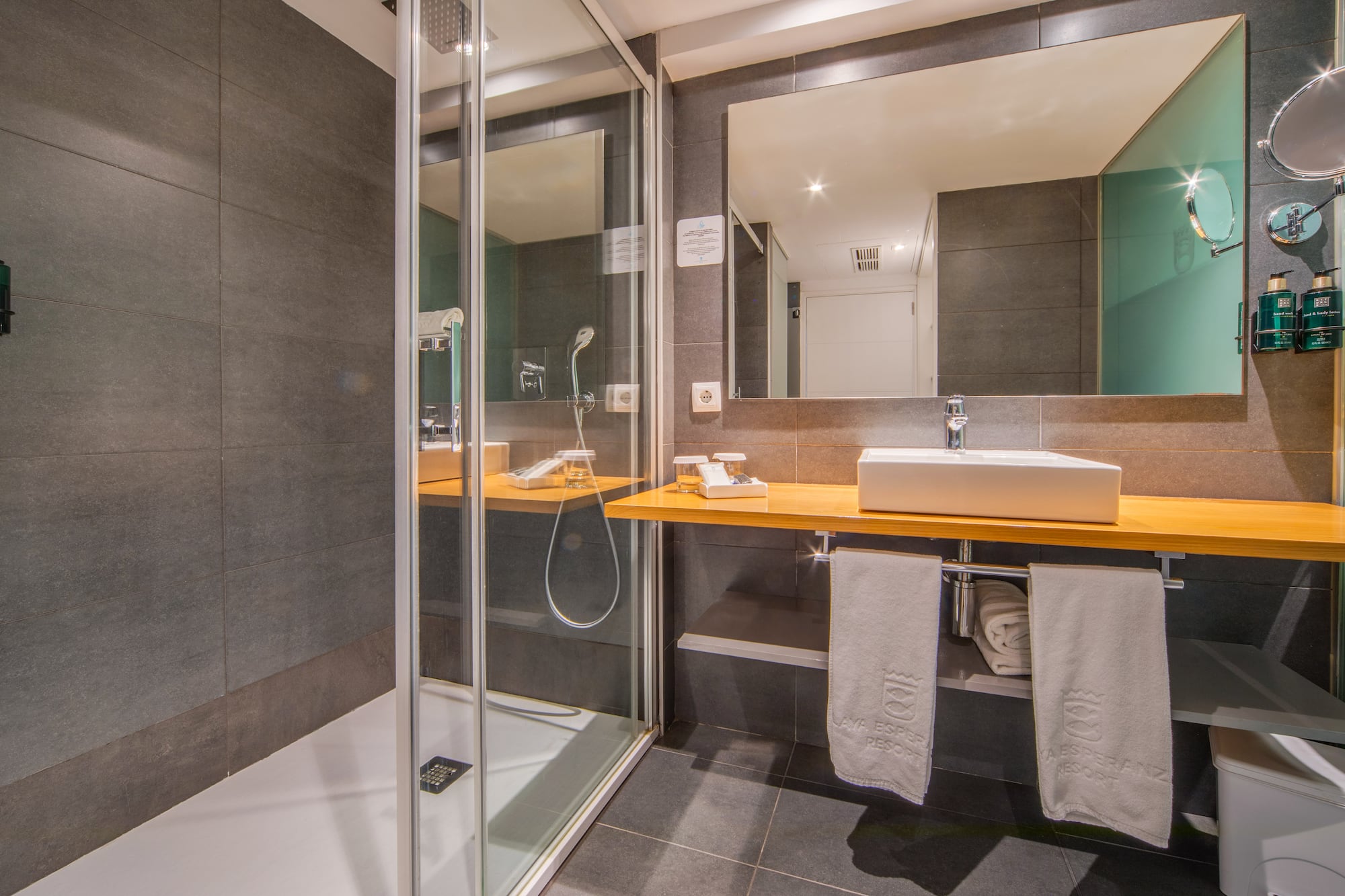 a bathroom with a shower and sink