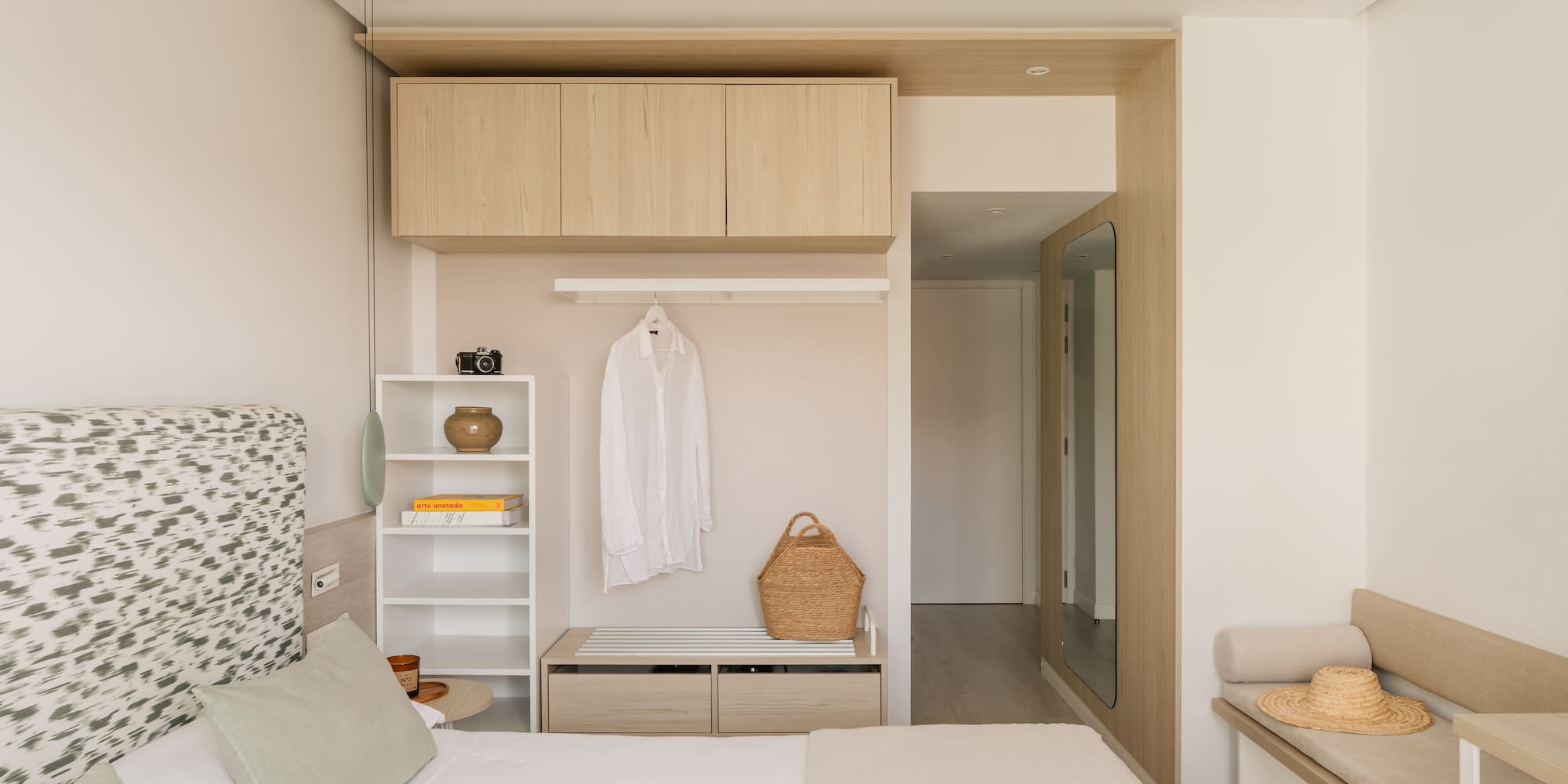 a bedroom with a bed and a shelf