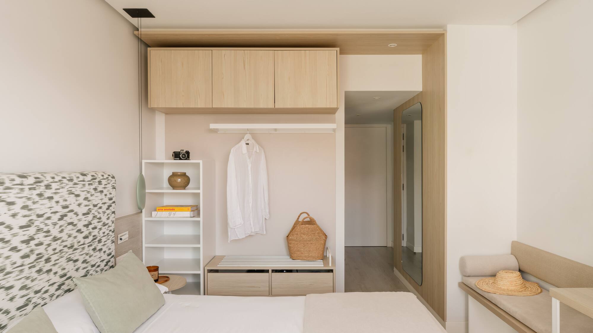 a bedroom with a bed and a shelf