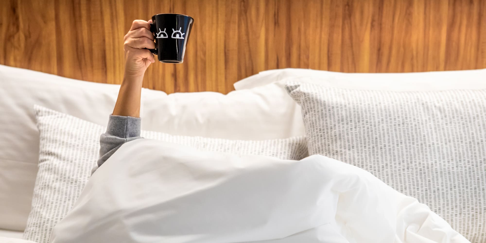 a person holding a cup in their hand