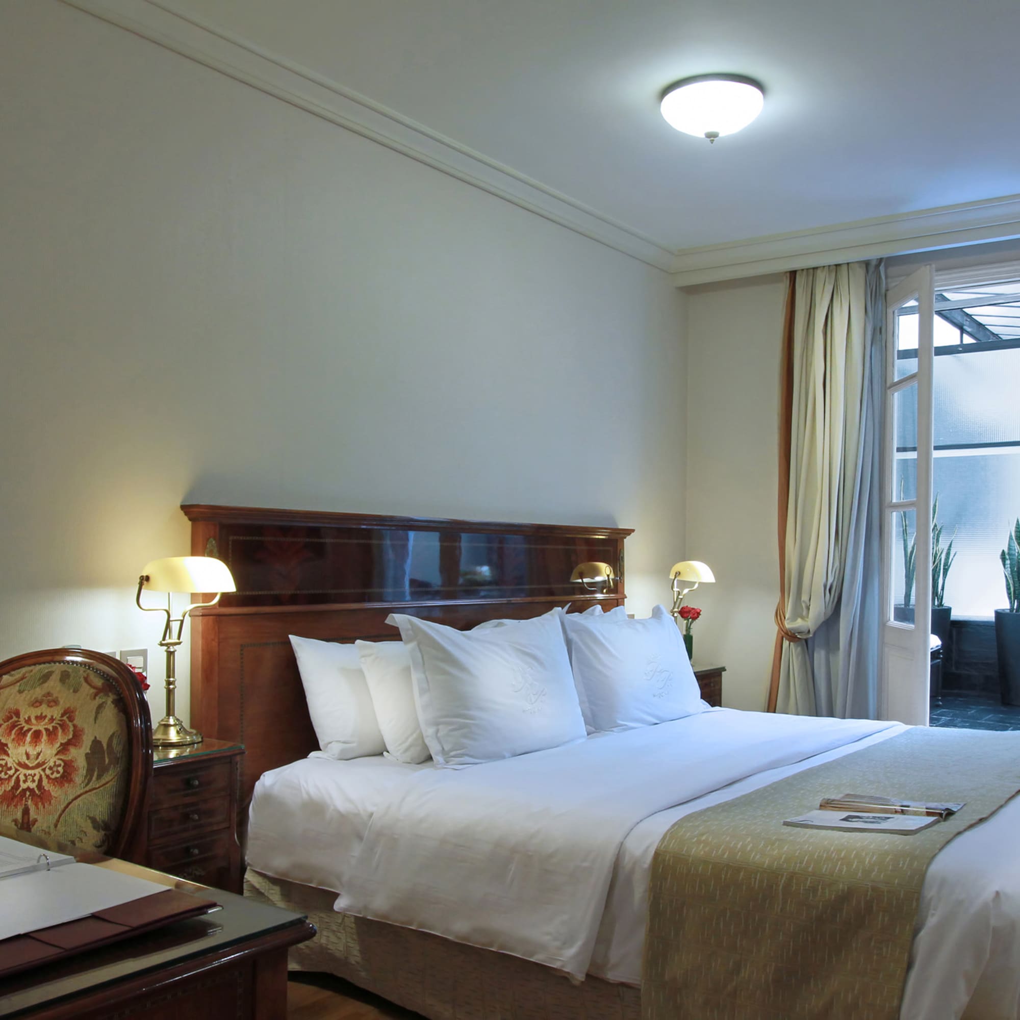 a bedroom with a bed and a desk