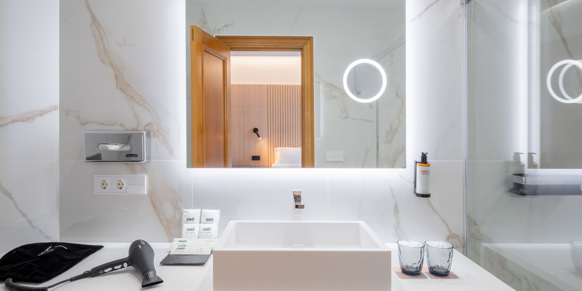 a bathroom with a mirror and a sink