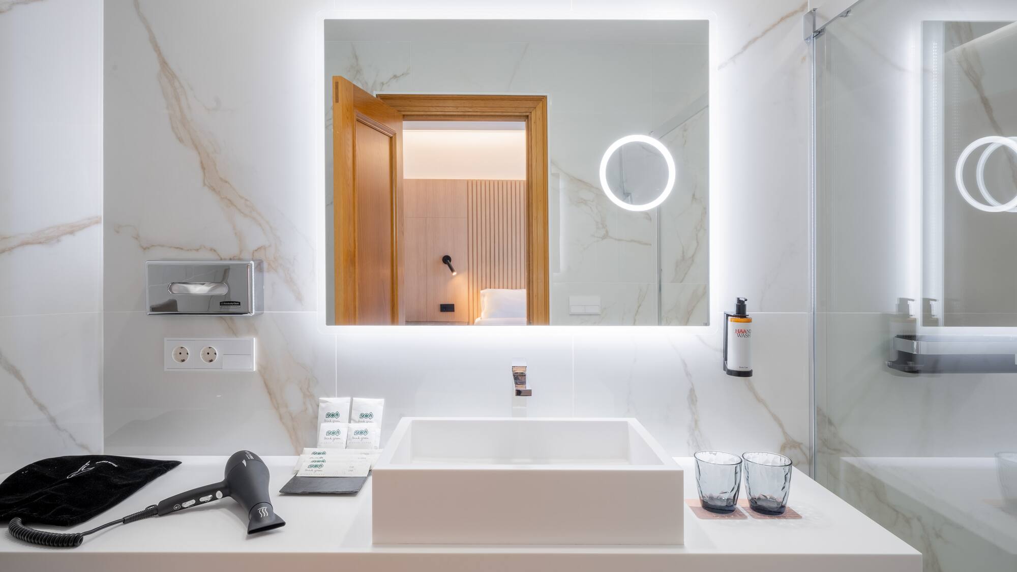 a bathroom with a mirror and a sink