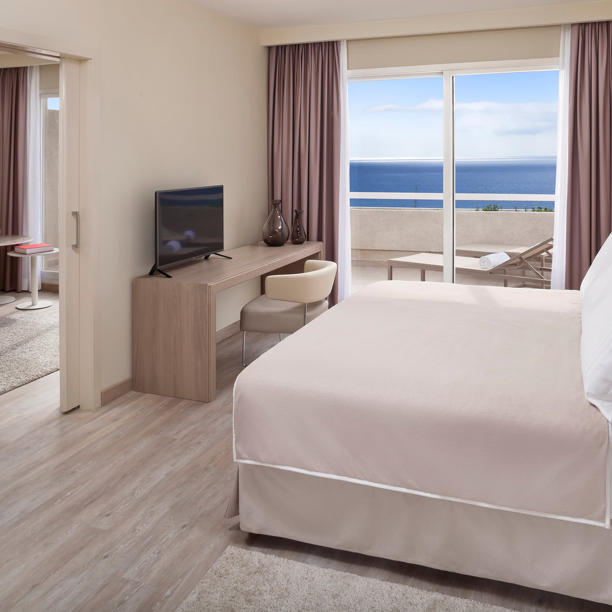 a room with a bed and a television