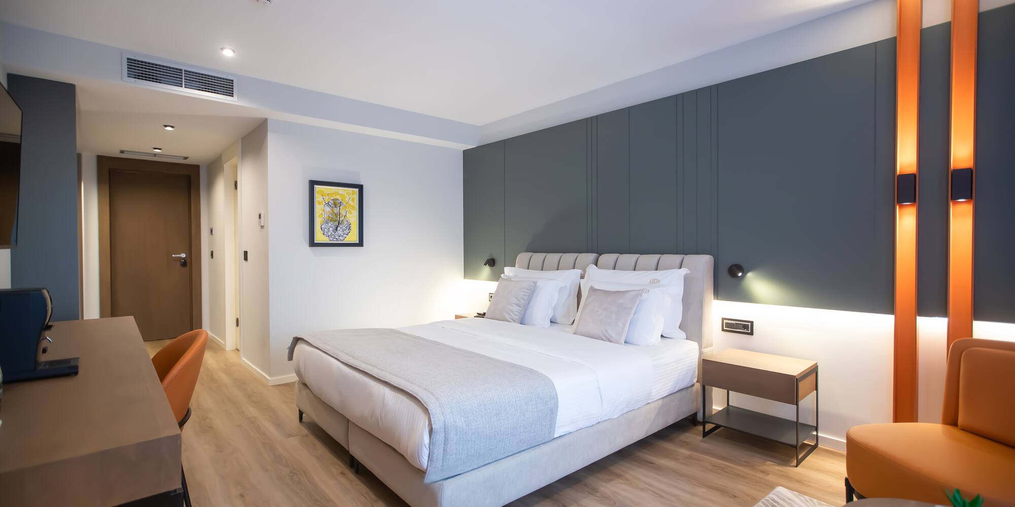 a bedroom with a bed and a chair