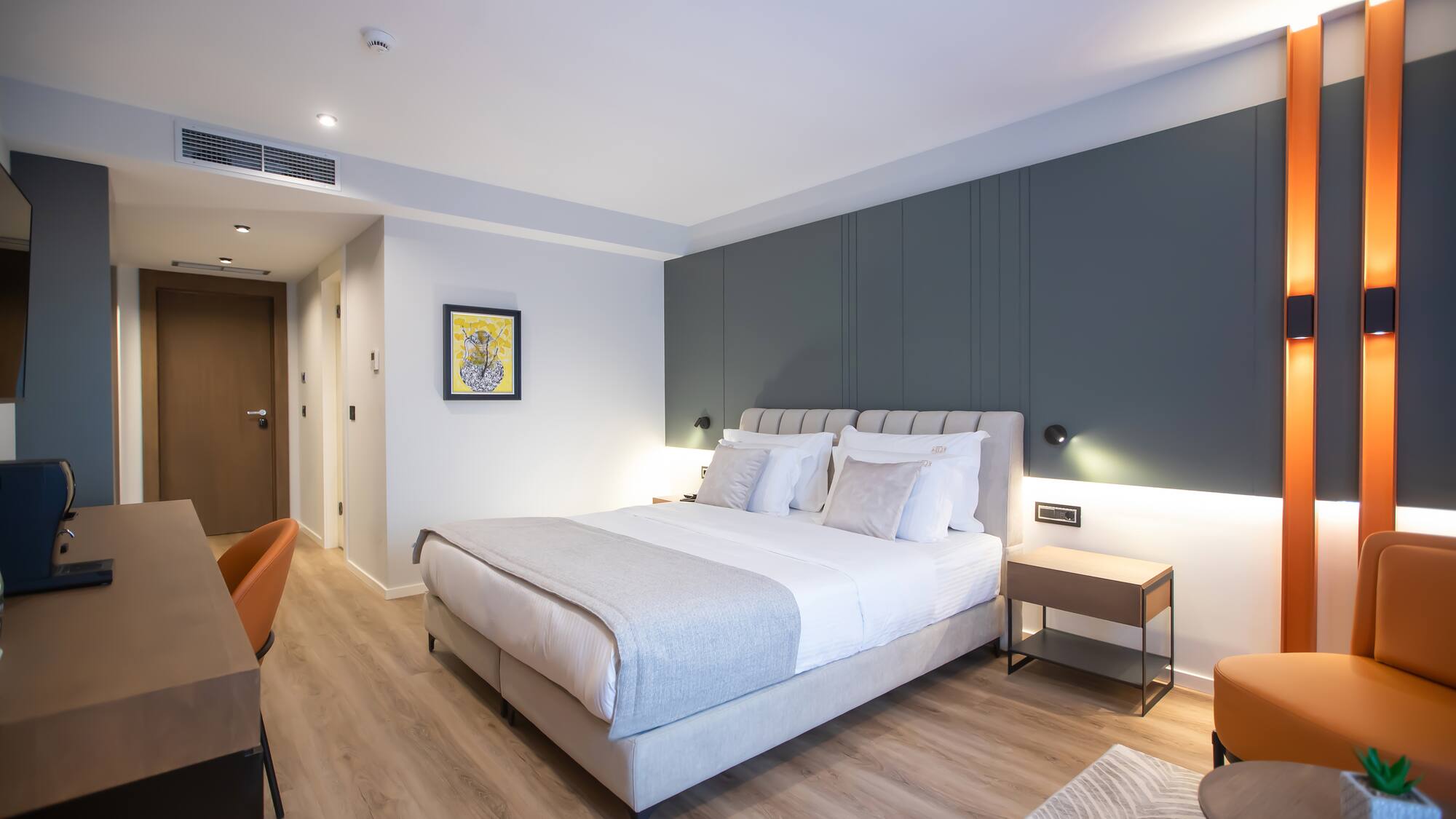 a bedroom with a bed and a chair