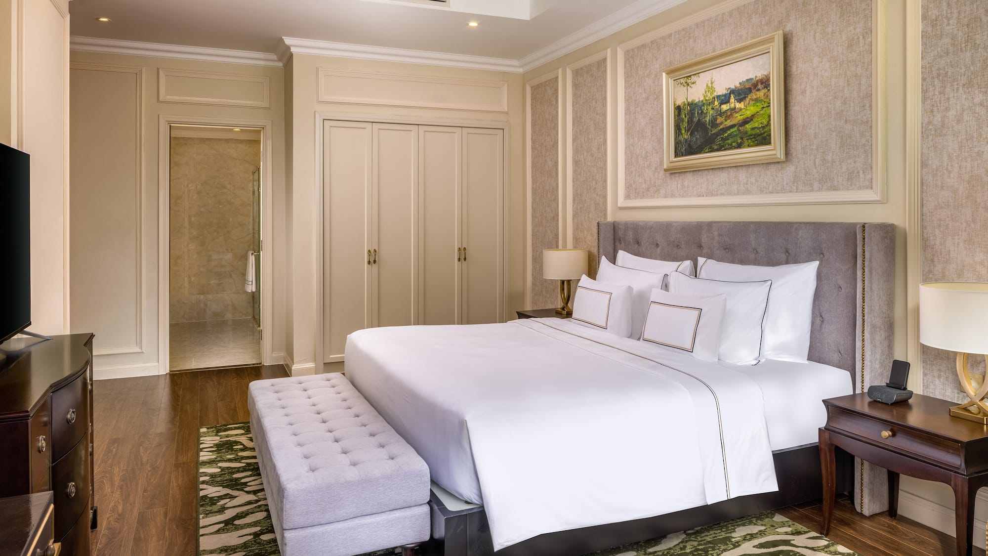 a bedroom with a bed and a bench