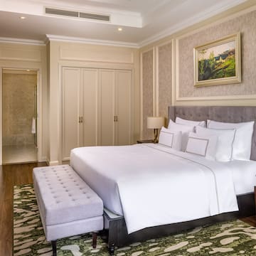 a bedroom with a bed and a bench