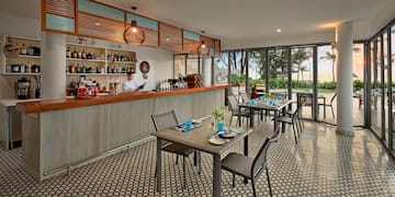 a restaurant with tables and chairs