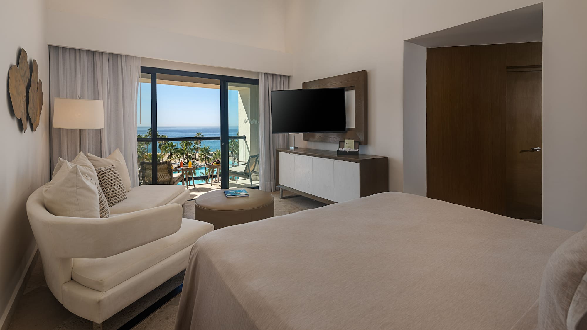 a bedroom with a television and a bed