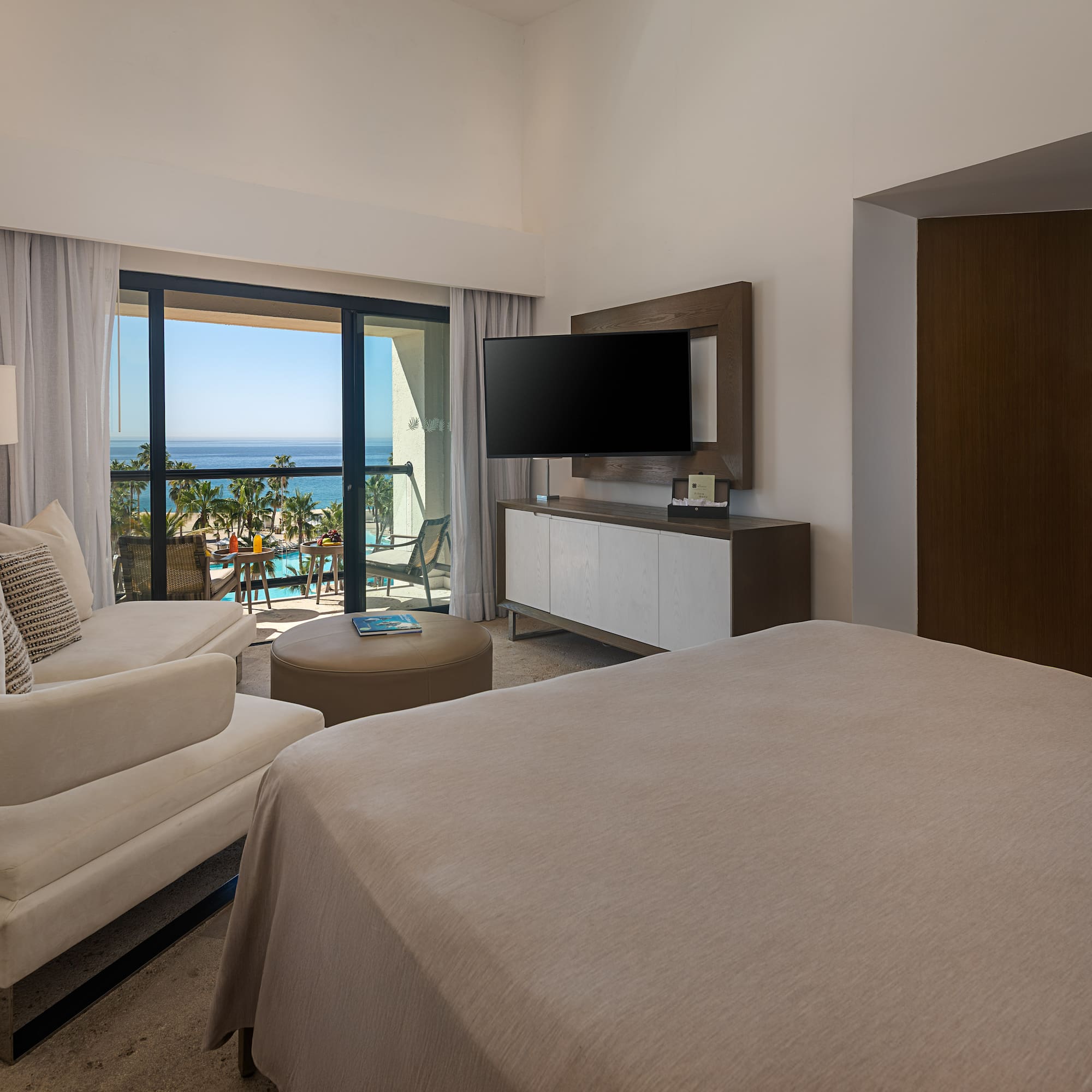 a bedroom with a television and a bed