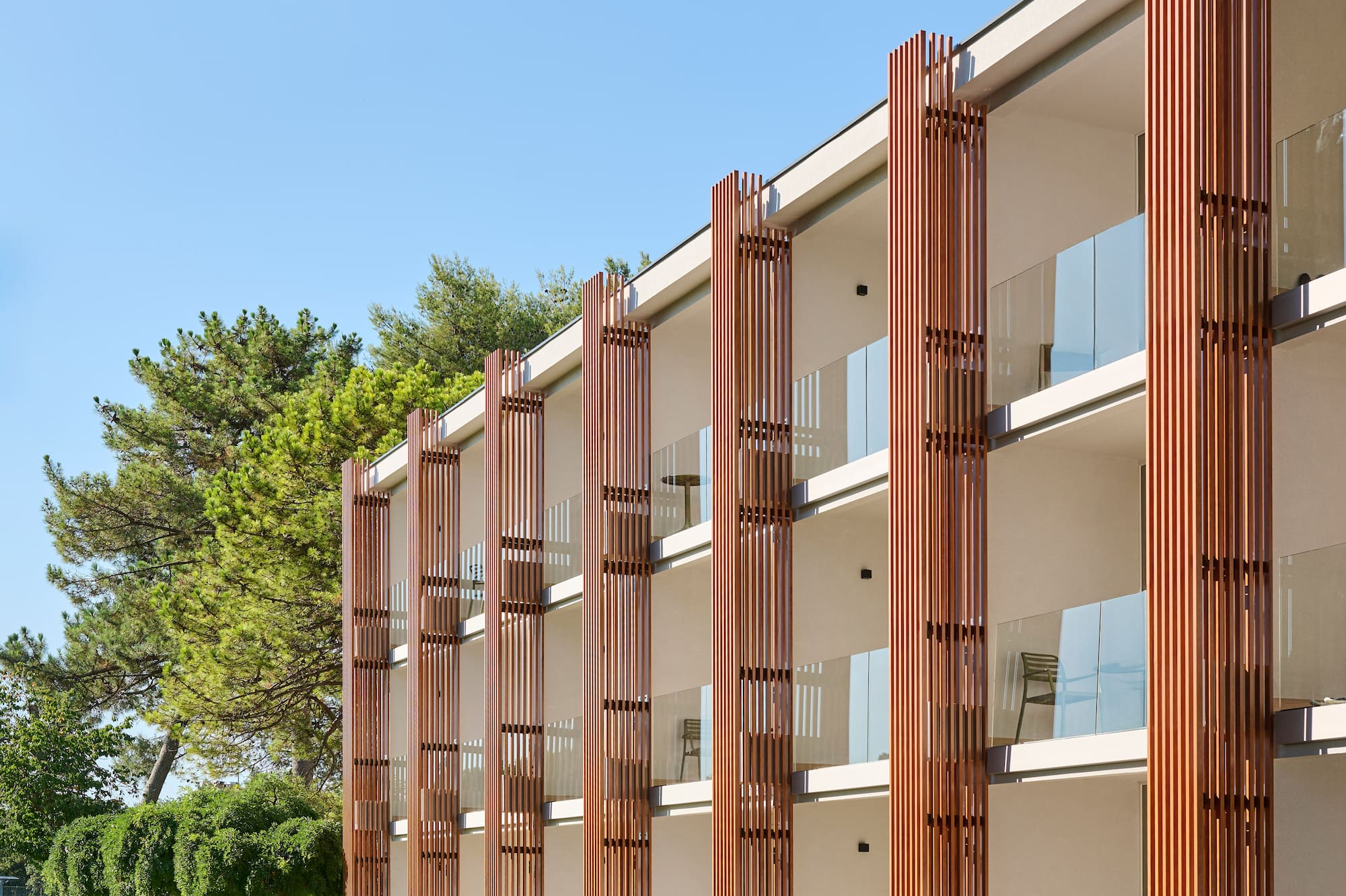 a building with trees and grass