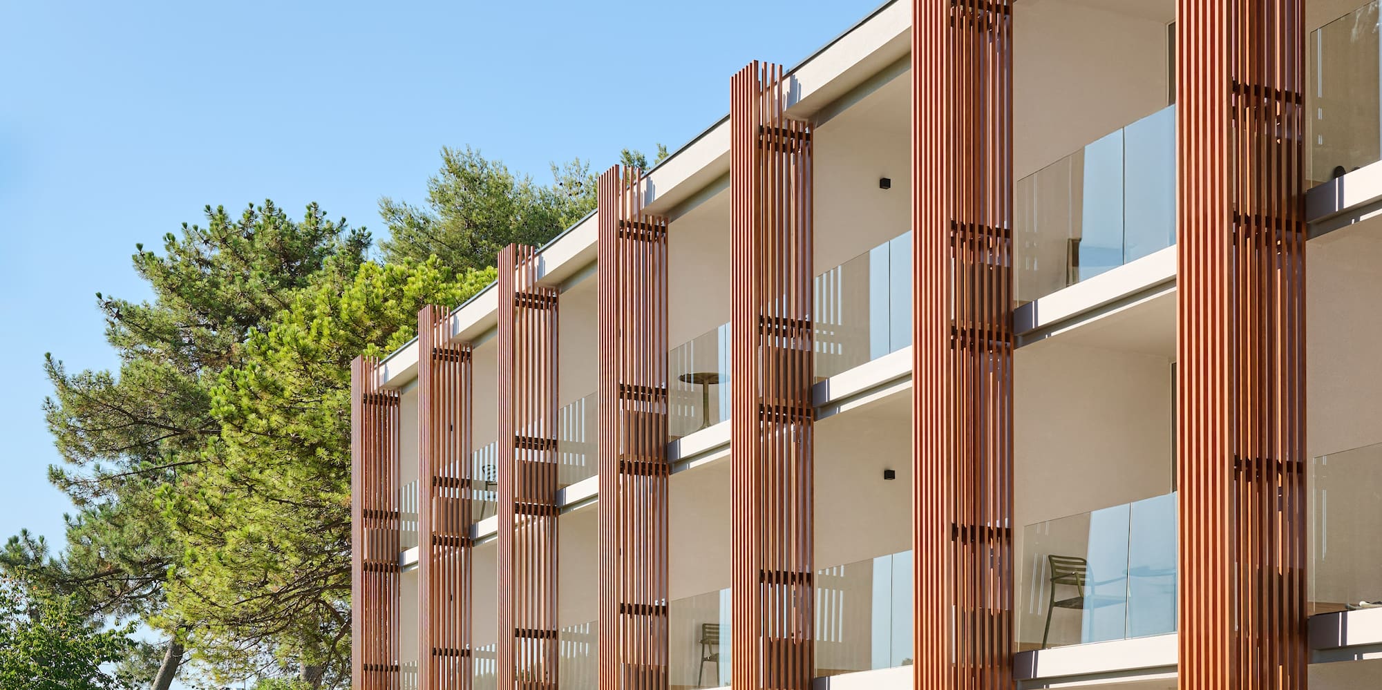 a building with trees and grass