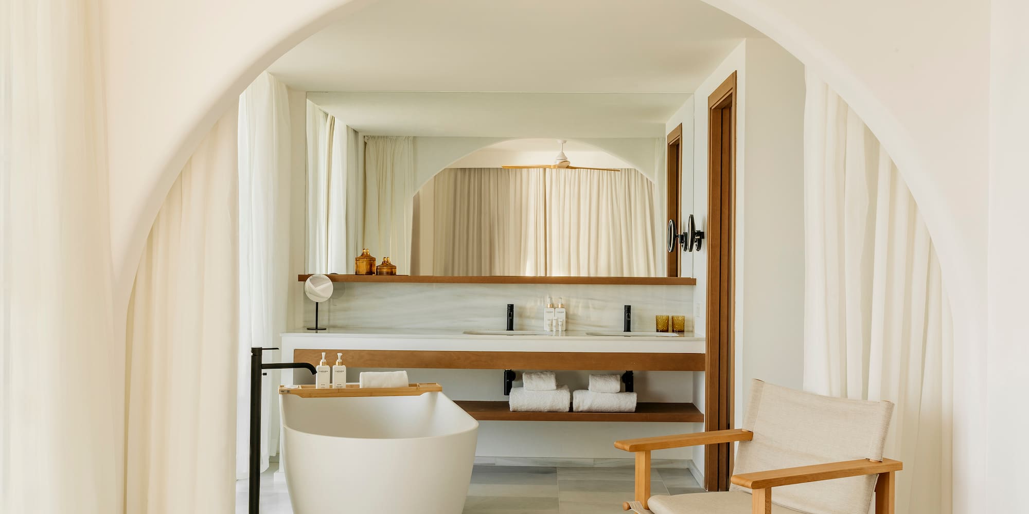 a bathroom with a tub and a sink