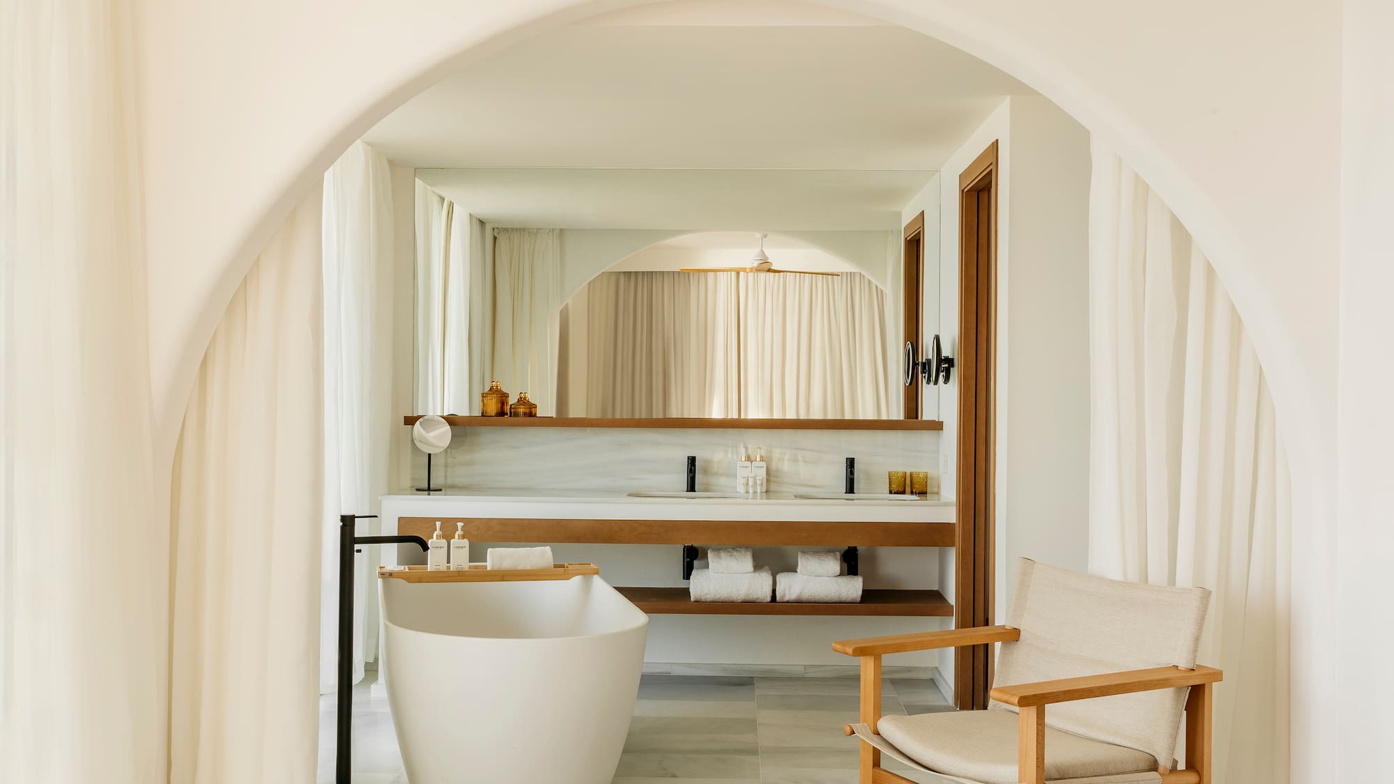 a bathroom with a tub and a sink