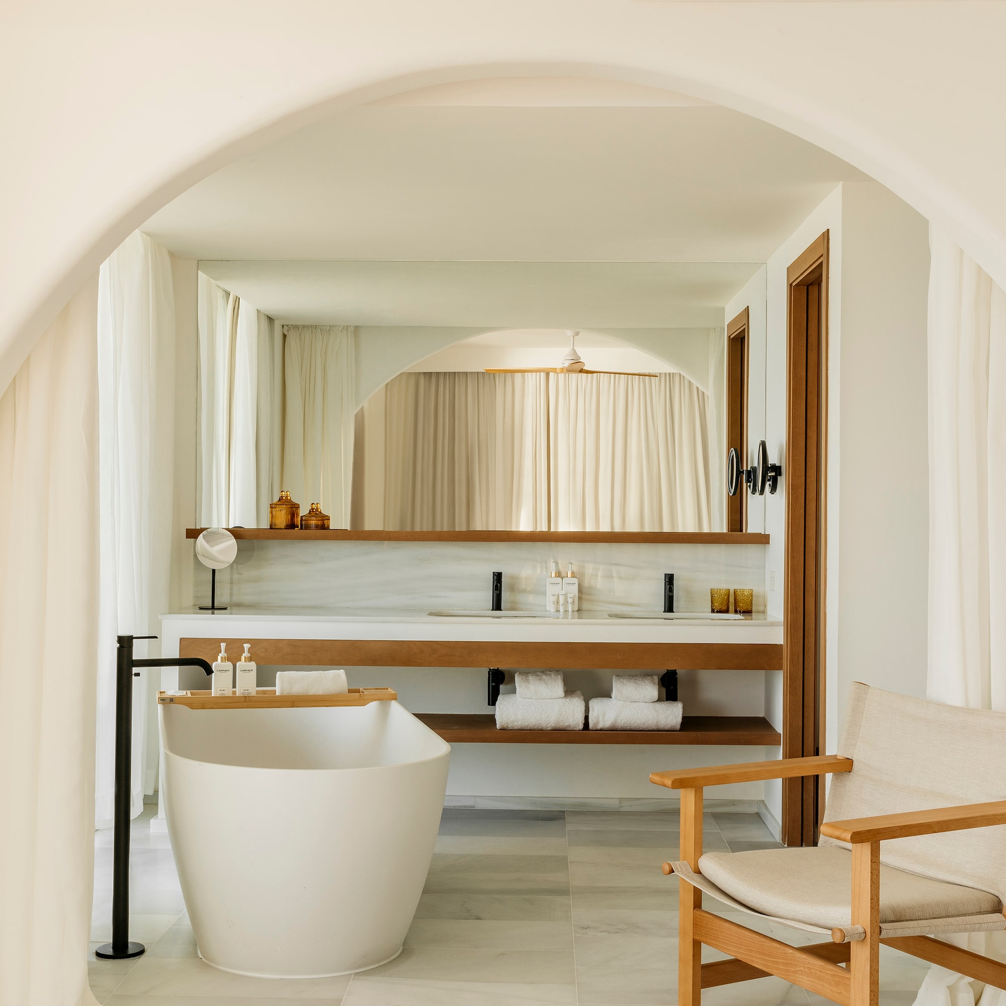 a bathroom with a tub and a sink