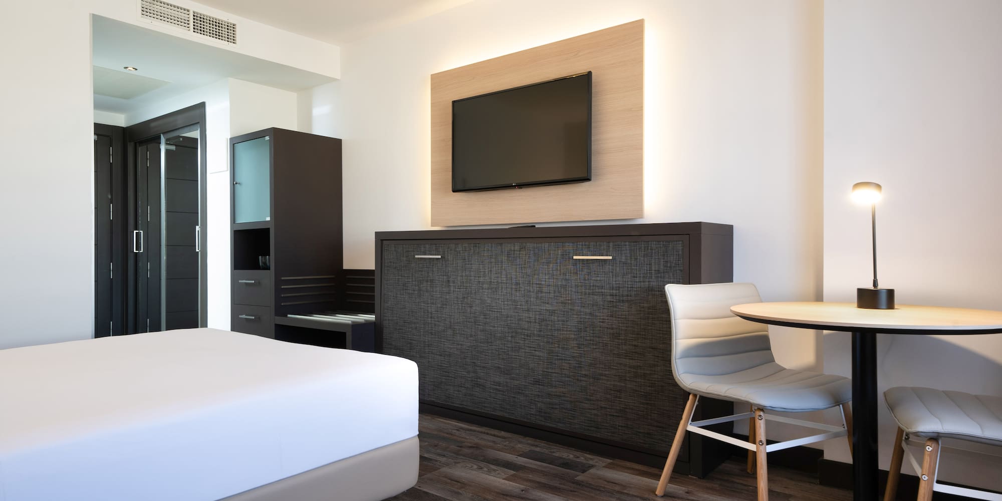 a room with a tv and a table