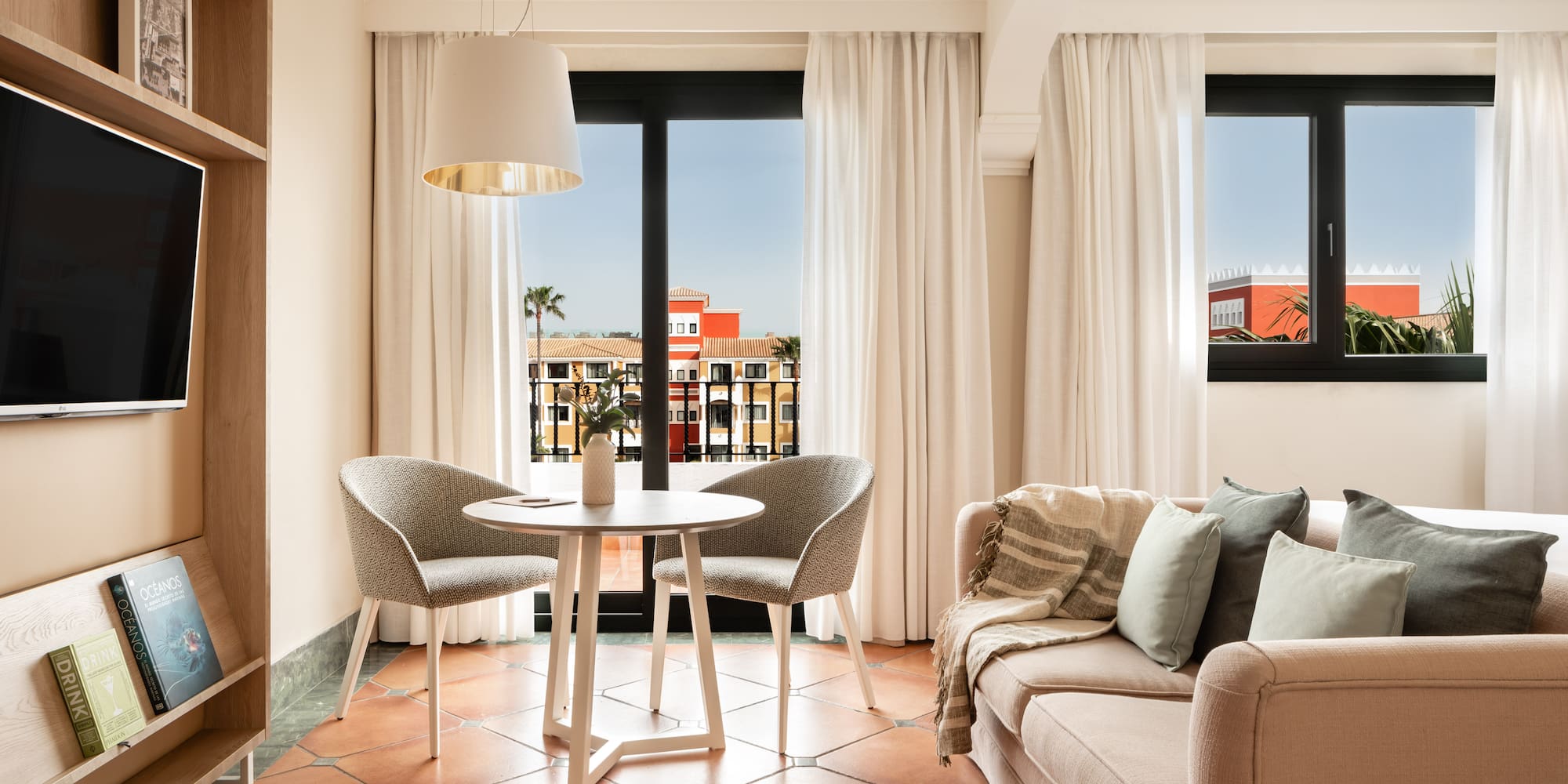 a living room with a couch and chairs