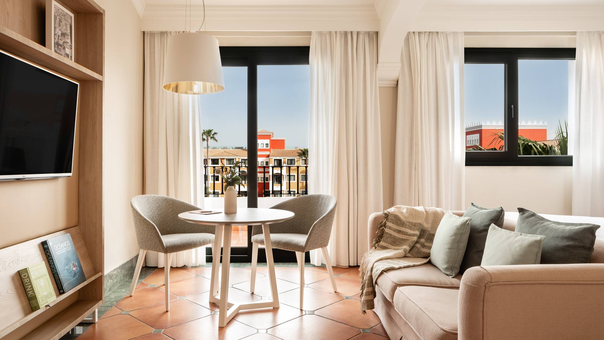 a living room with a couch and chairs