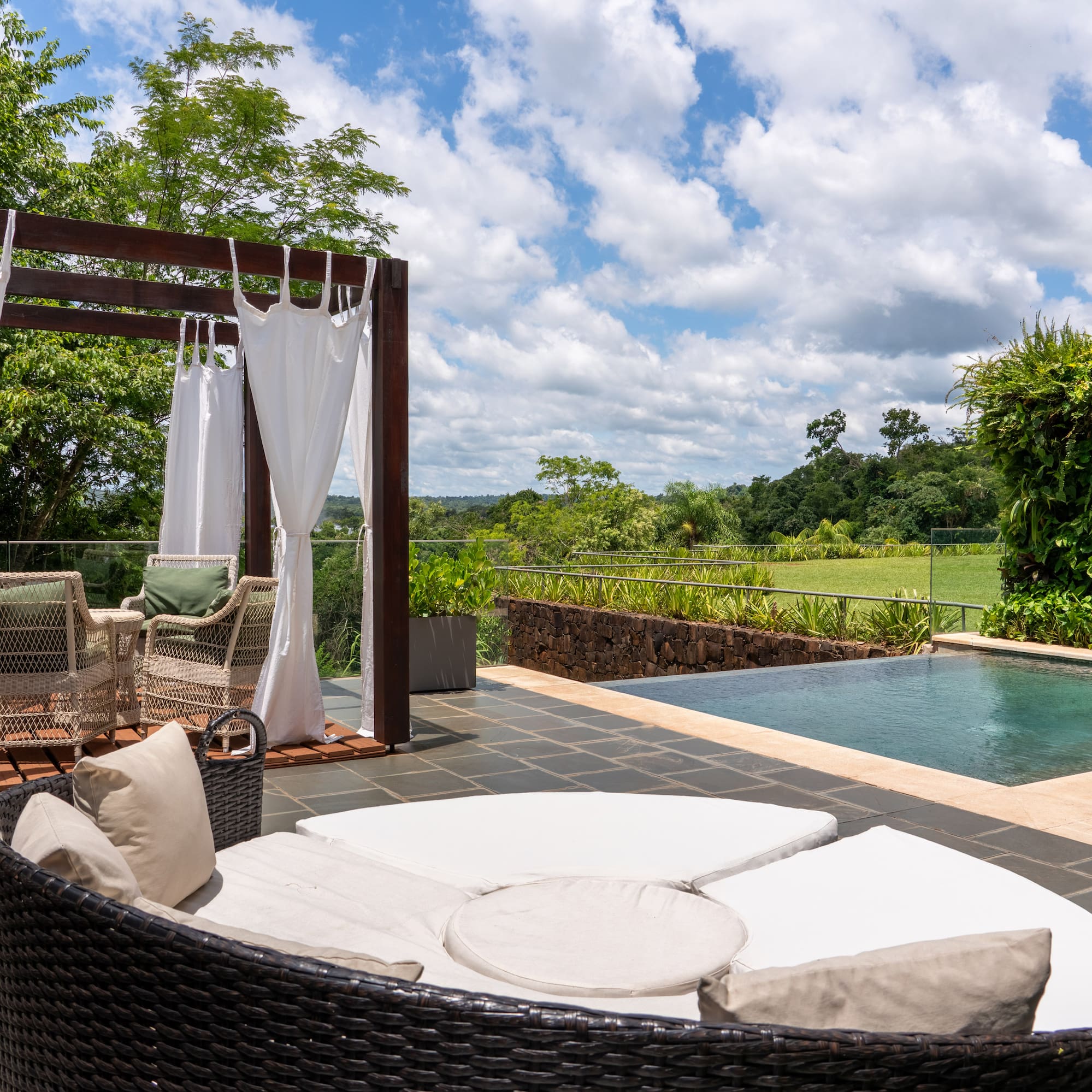 a pool with a chair and a table