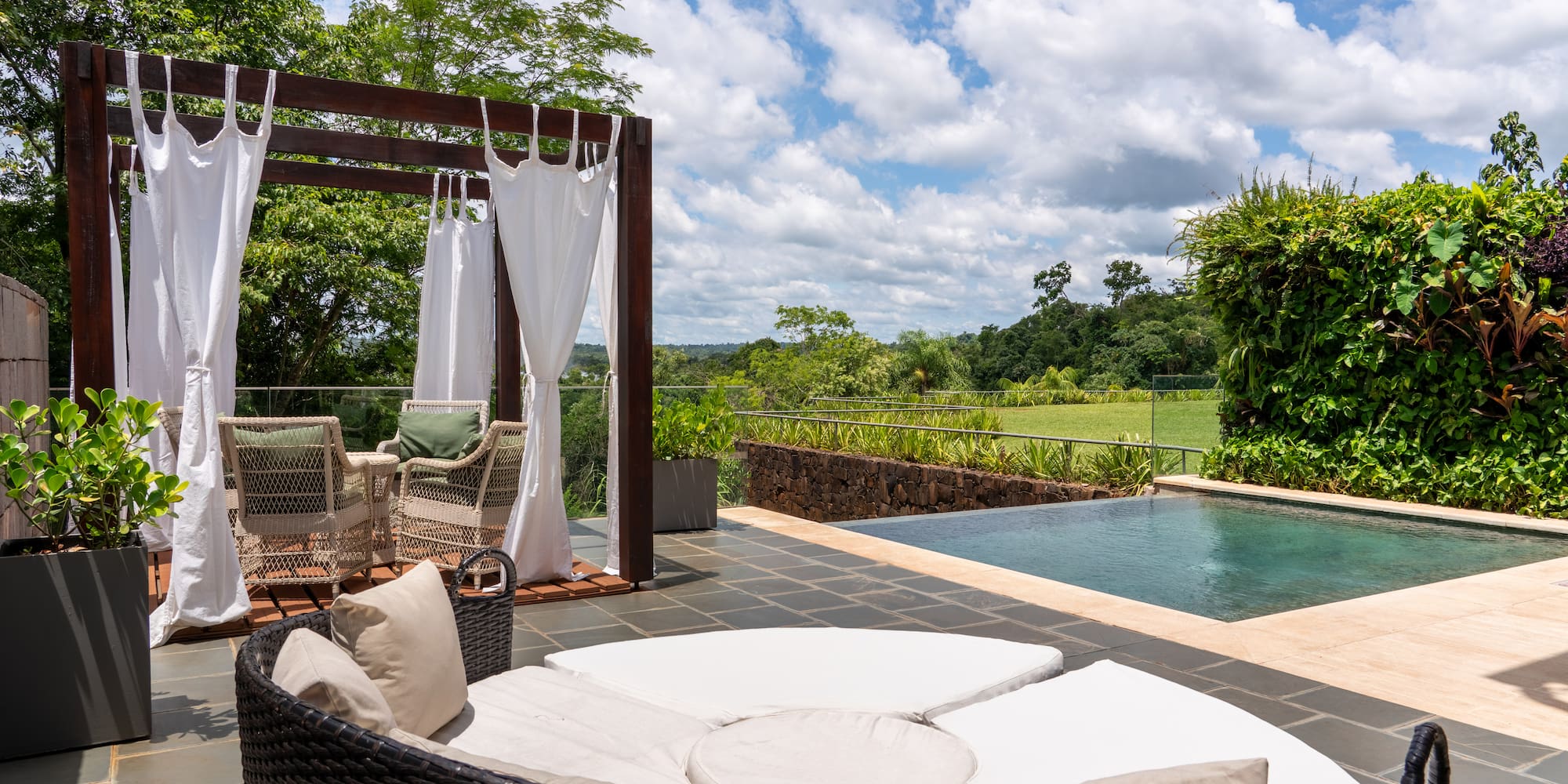 a pool with a chair and a table
