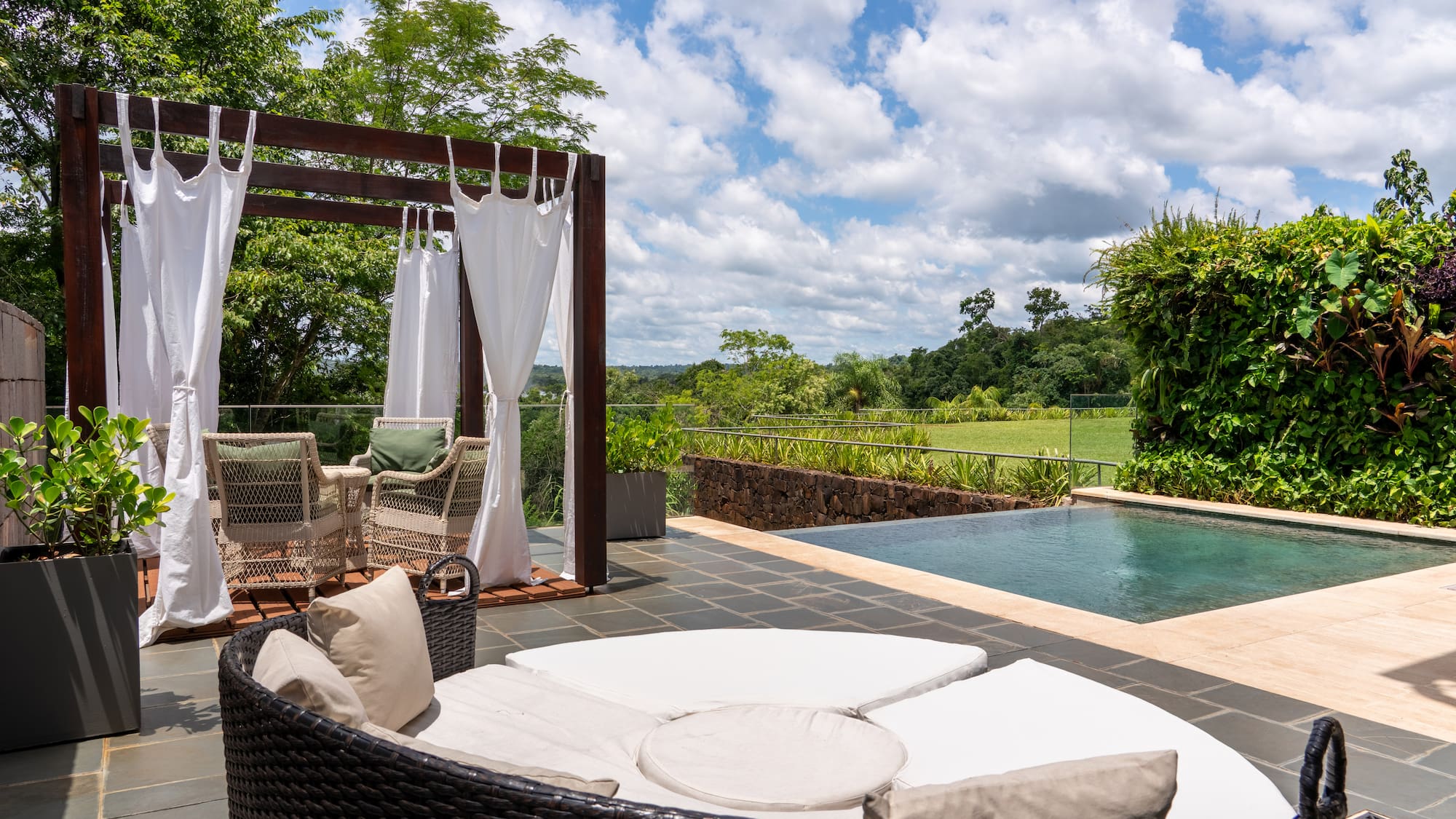 a pool with a chair and a table