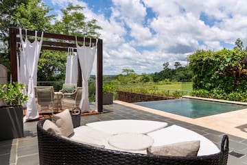 a pool with a chair and a table