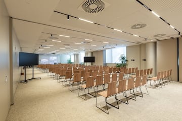 a room with rows of chairs
