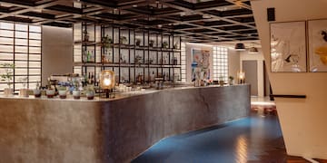 a bar with bottles on the counter