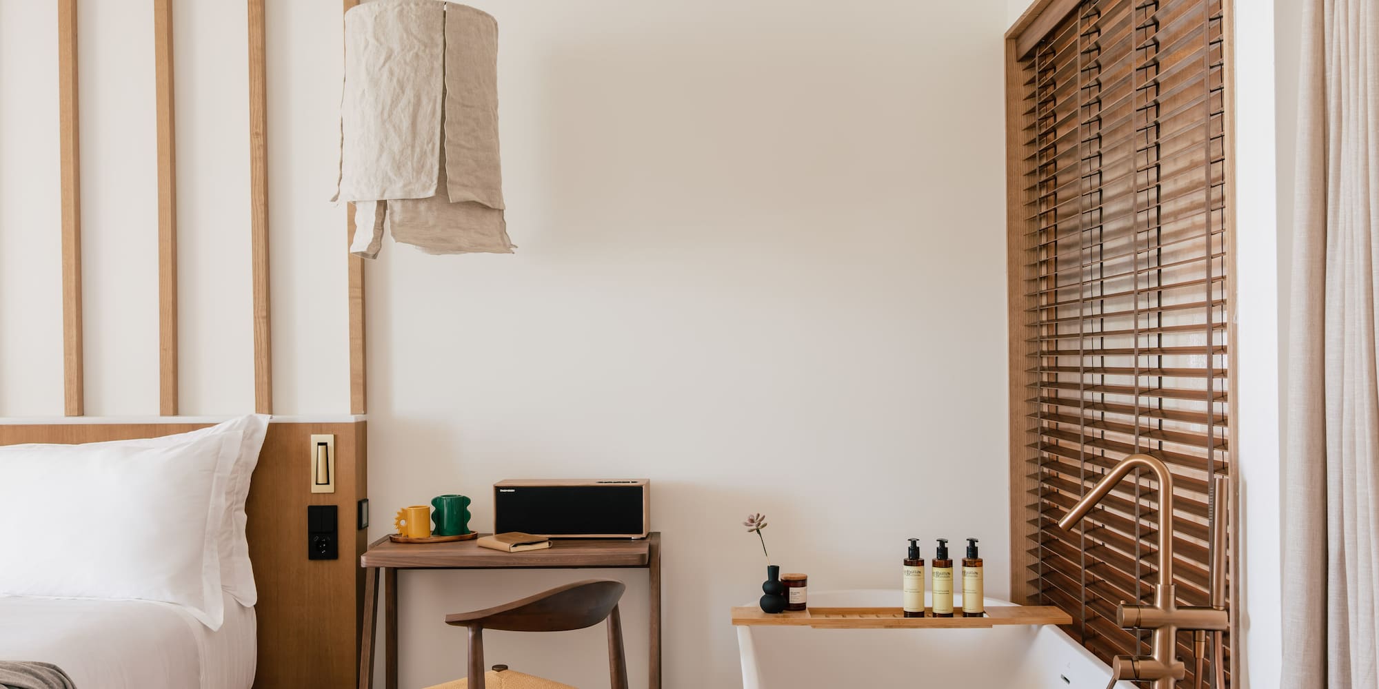 a room with a bathtub and a desk