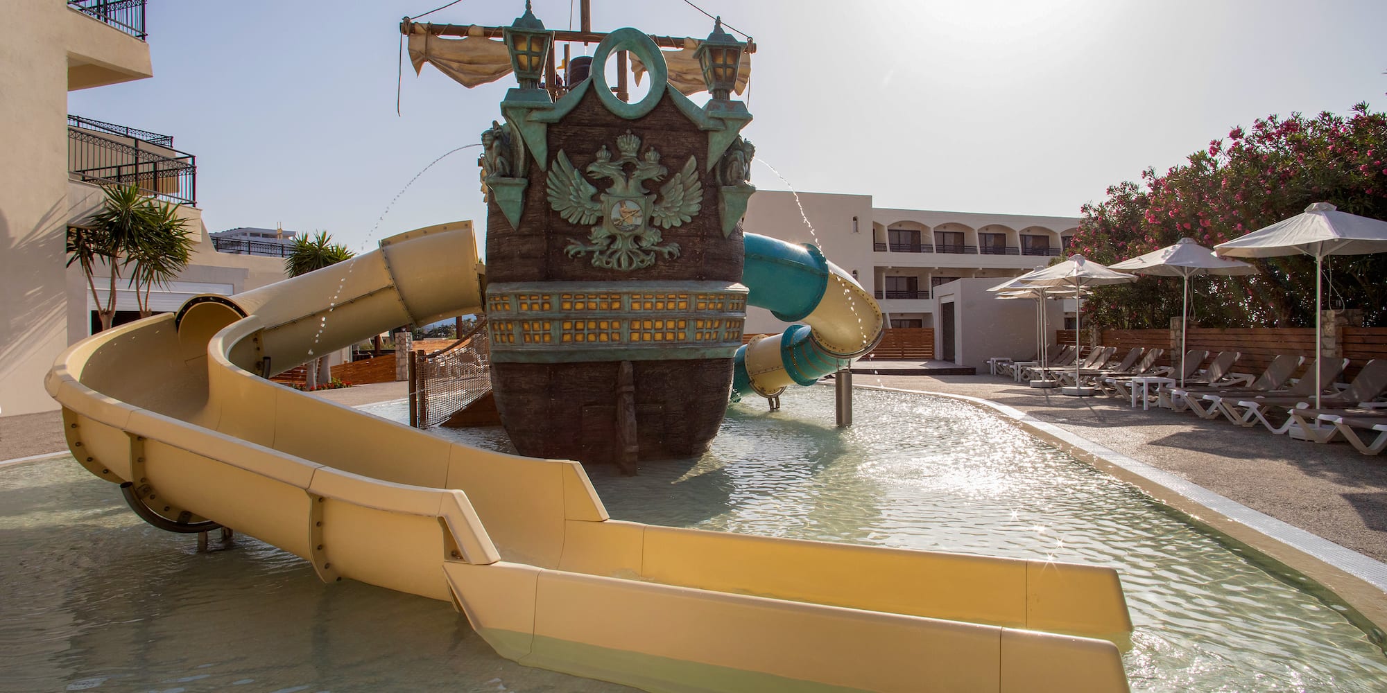 a water park with a ship and slides