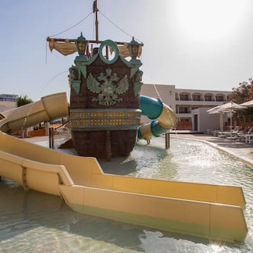 a water park with a ship and slides