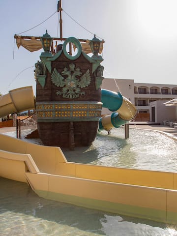 a water park with a ship and slides