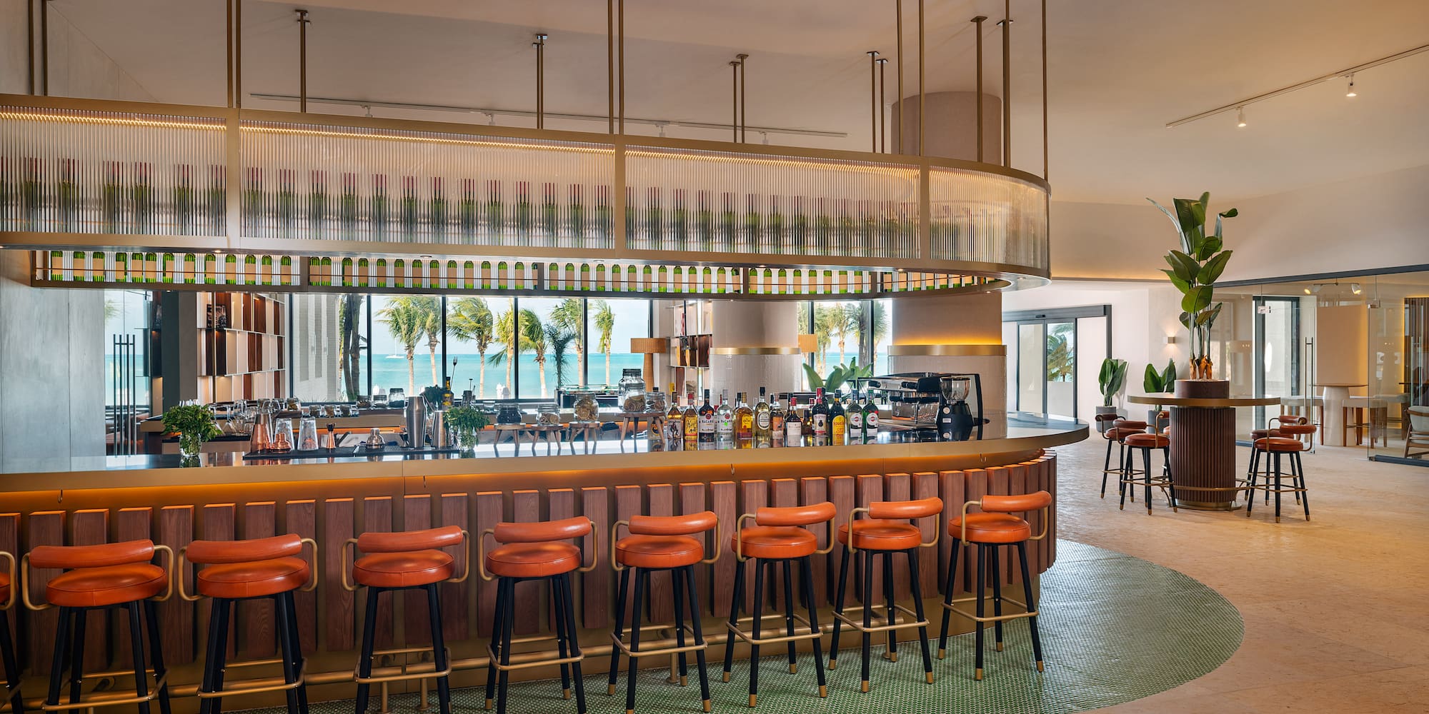 a bar with chairs and a long counter