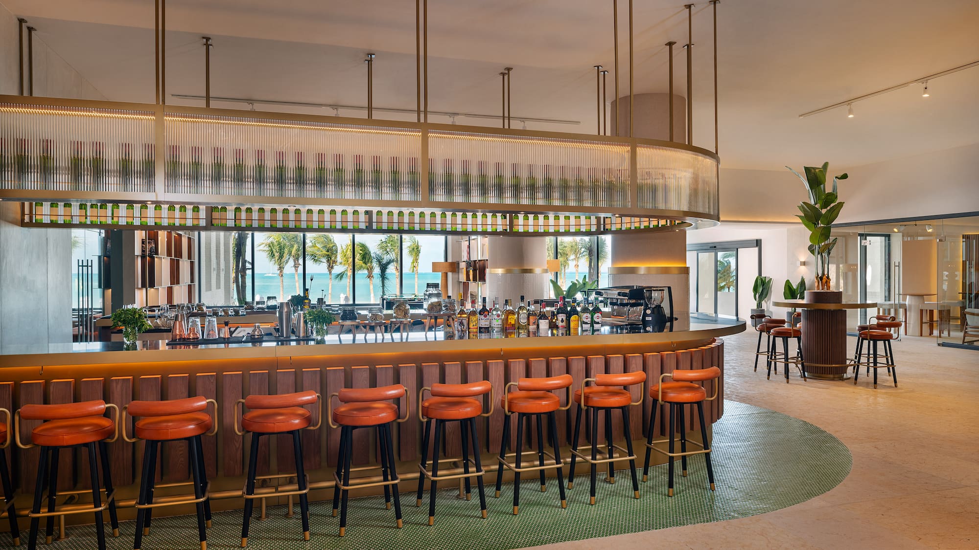 a bar with chairs and a long counter