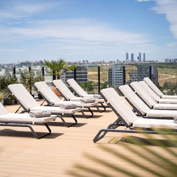 a group of lounge chairs on a deck