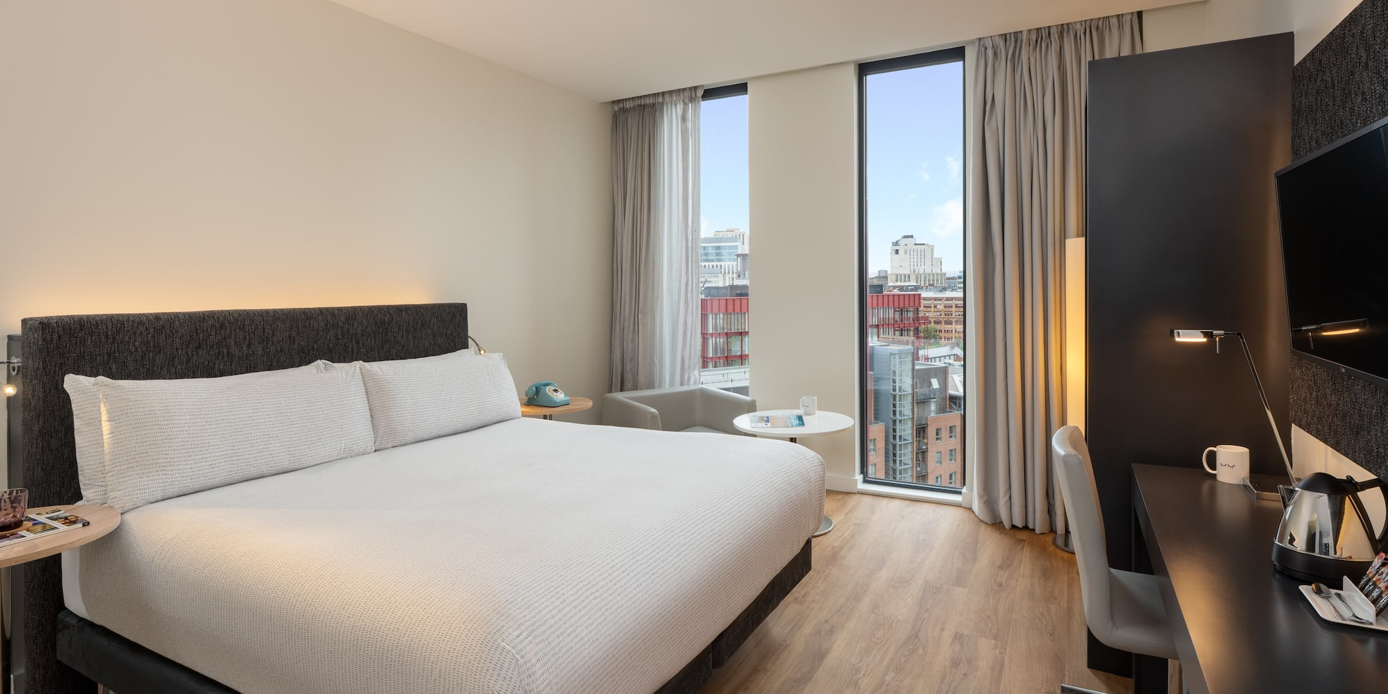 a room with a bed and a desk