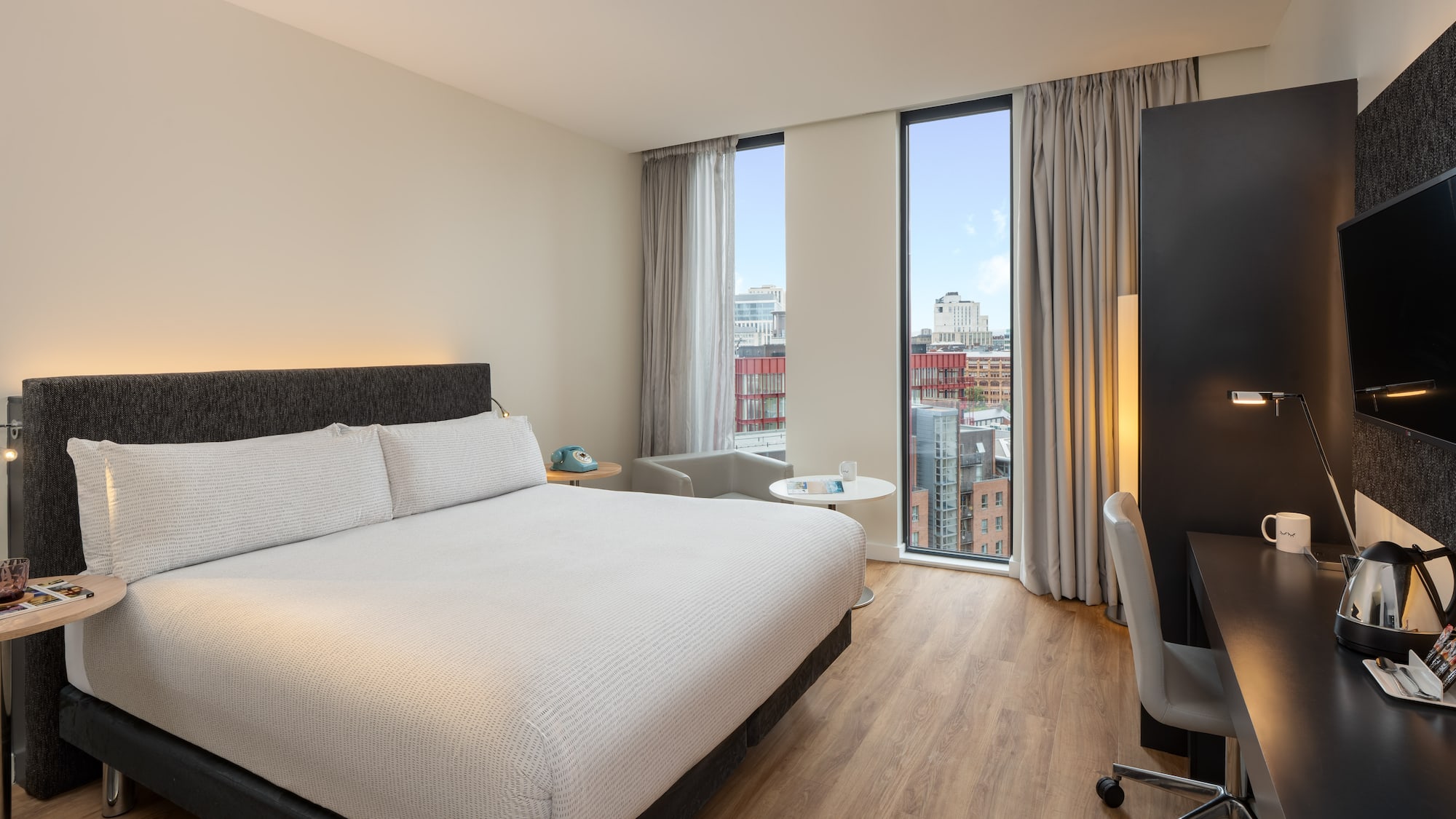 a room with a bed and a desk