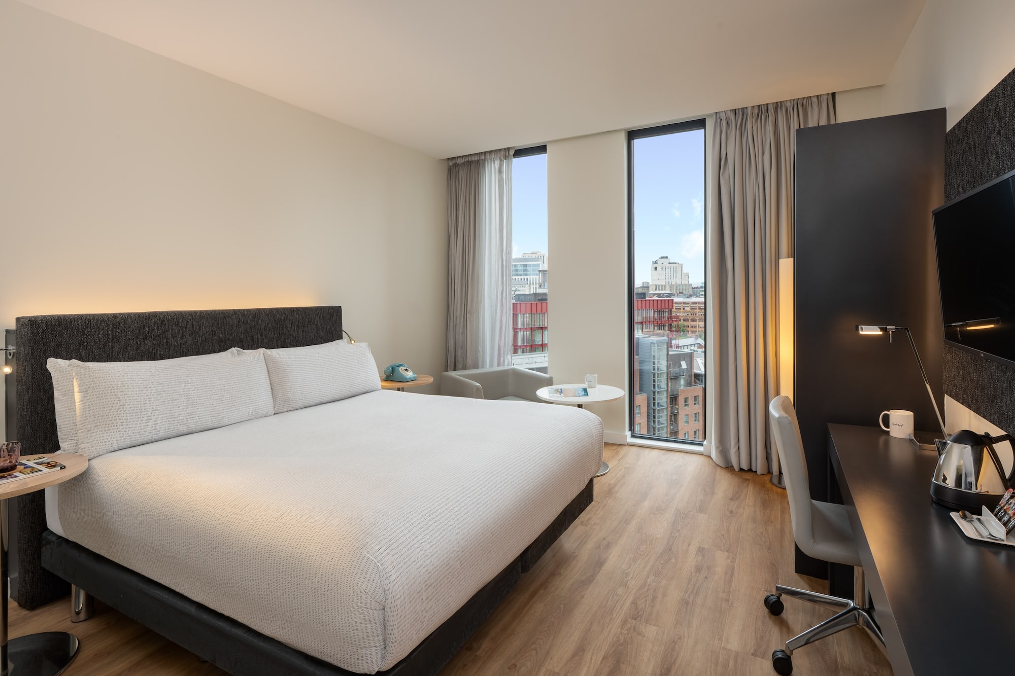 a room with a bed and a desk