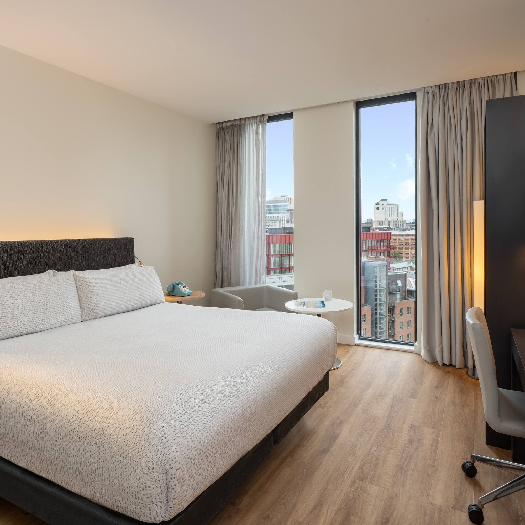 a room with a bed and a desk