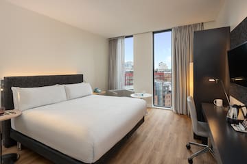 a room with a bed and a desk