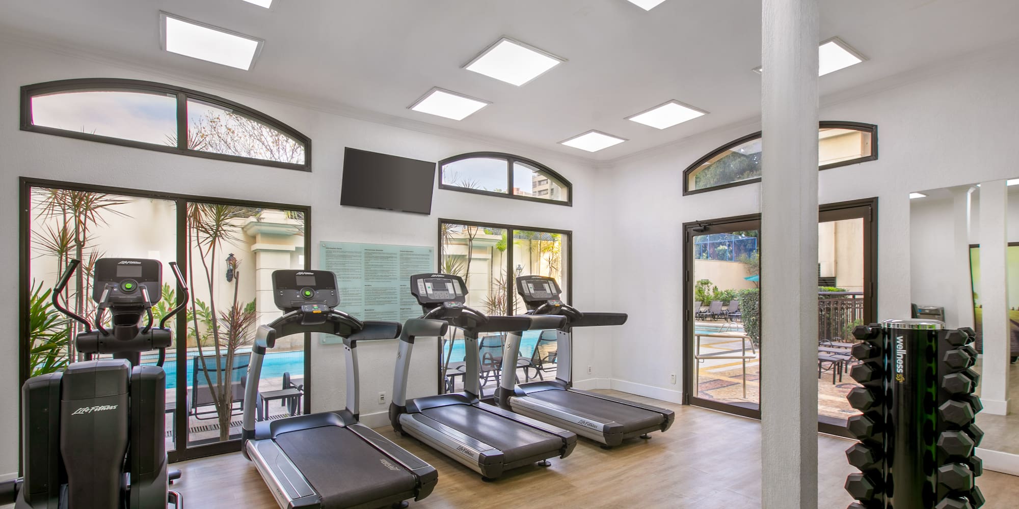 a room with treadmills and exercise equipment