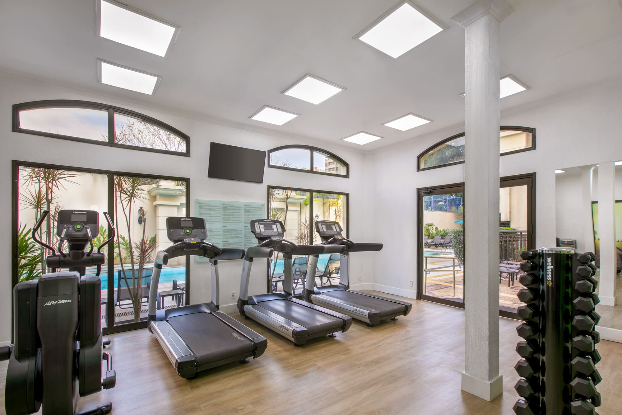 a room with treadmills and exercise equipment