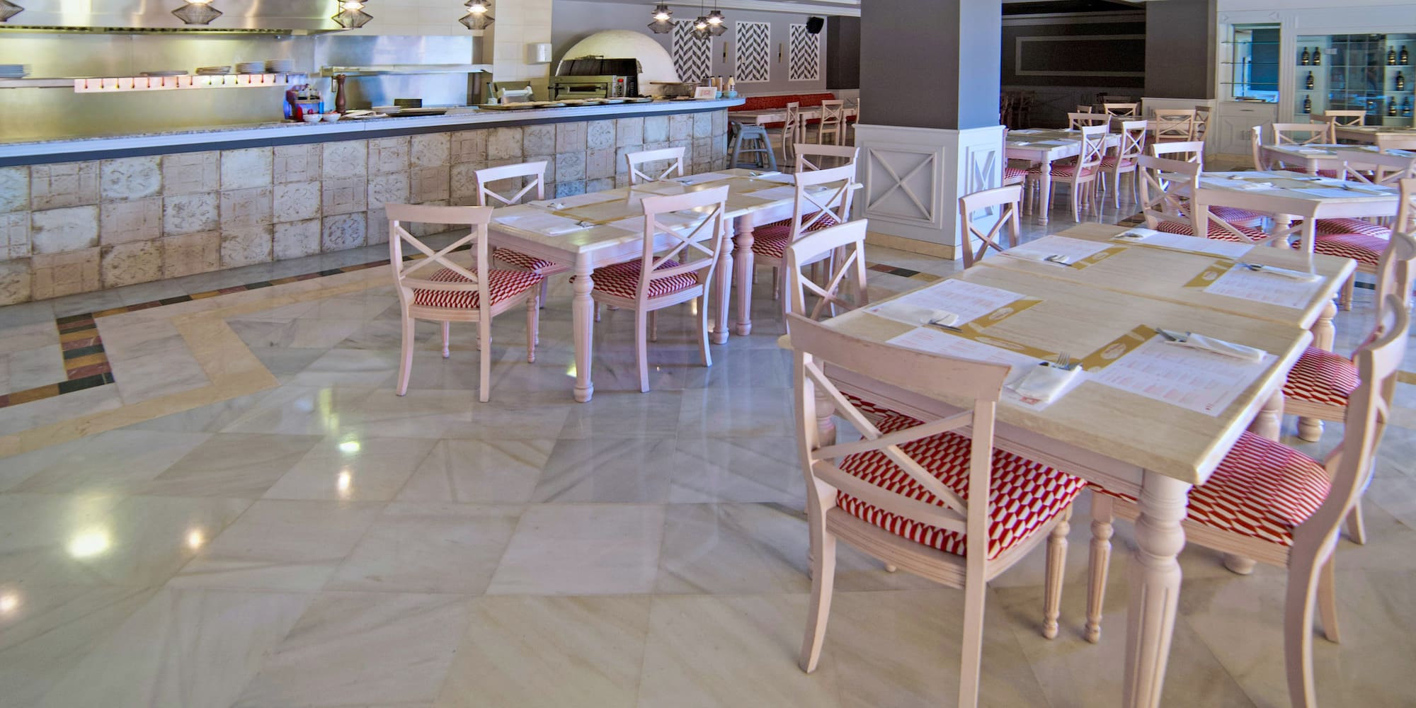 a large restaurant with tables and chairs