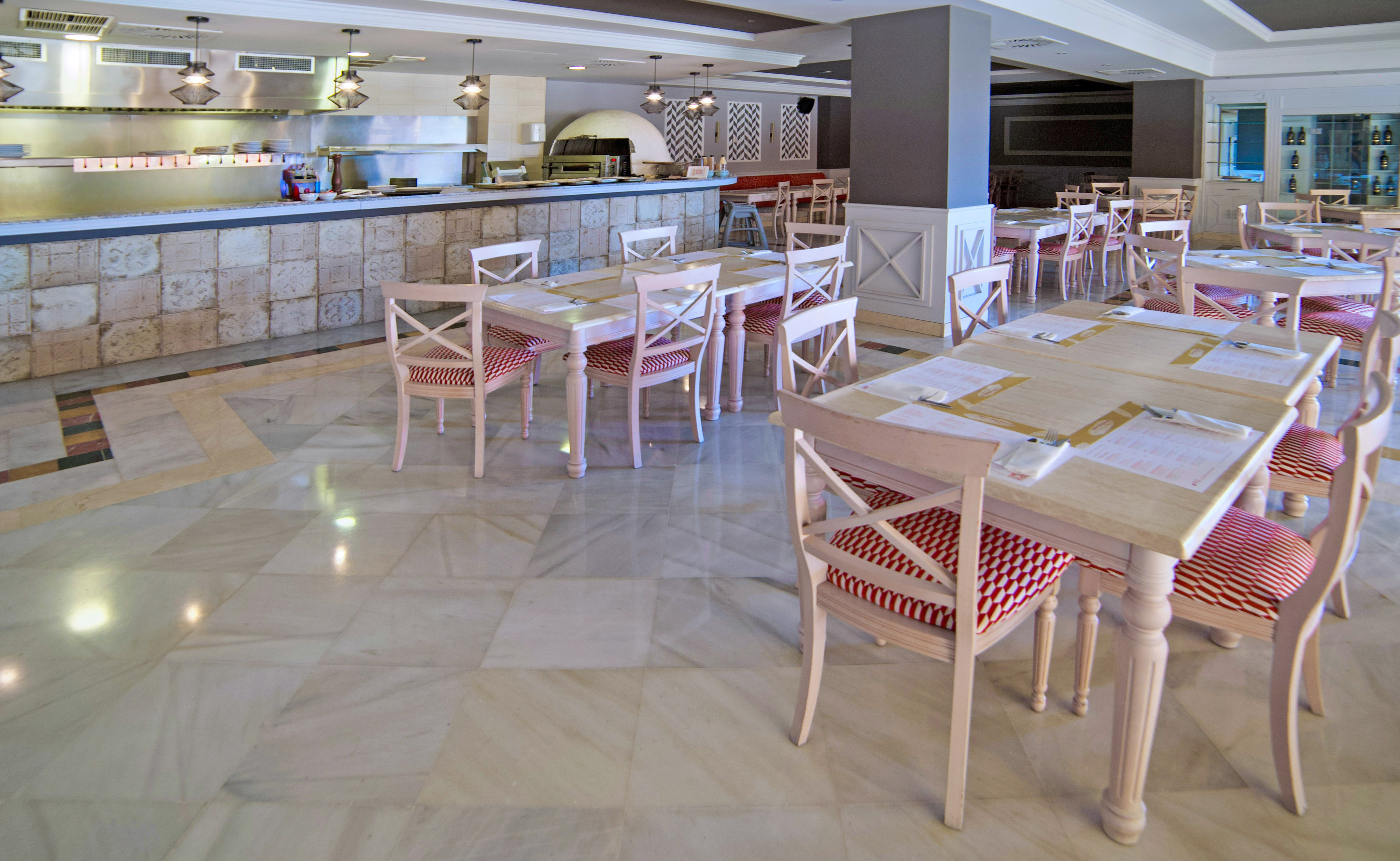 a large restaurant with tables and chairs