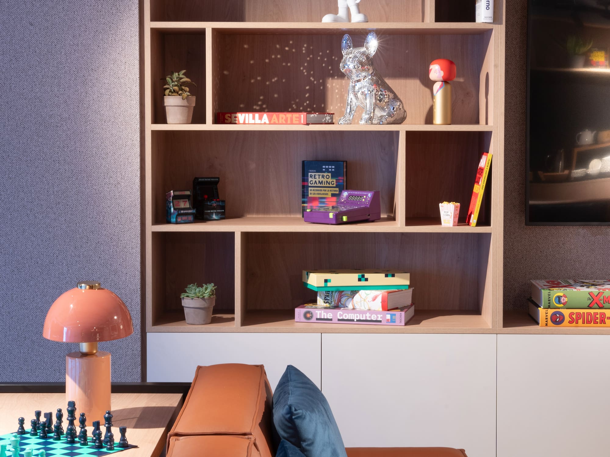 a room with a couch and a bookcase