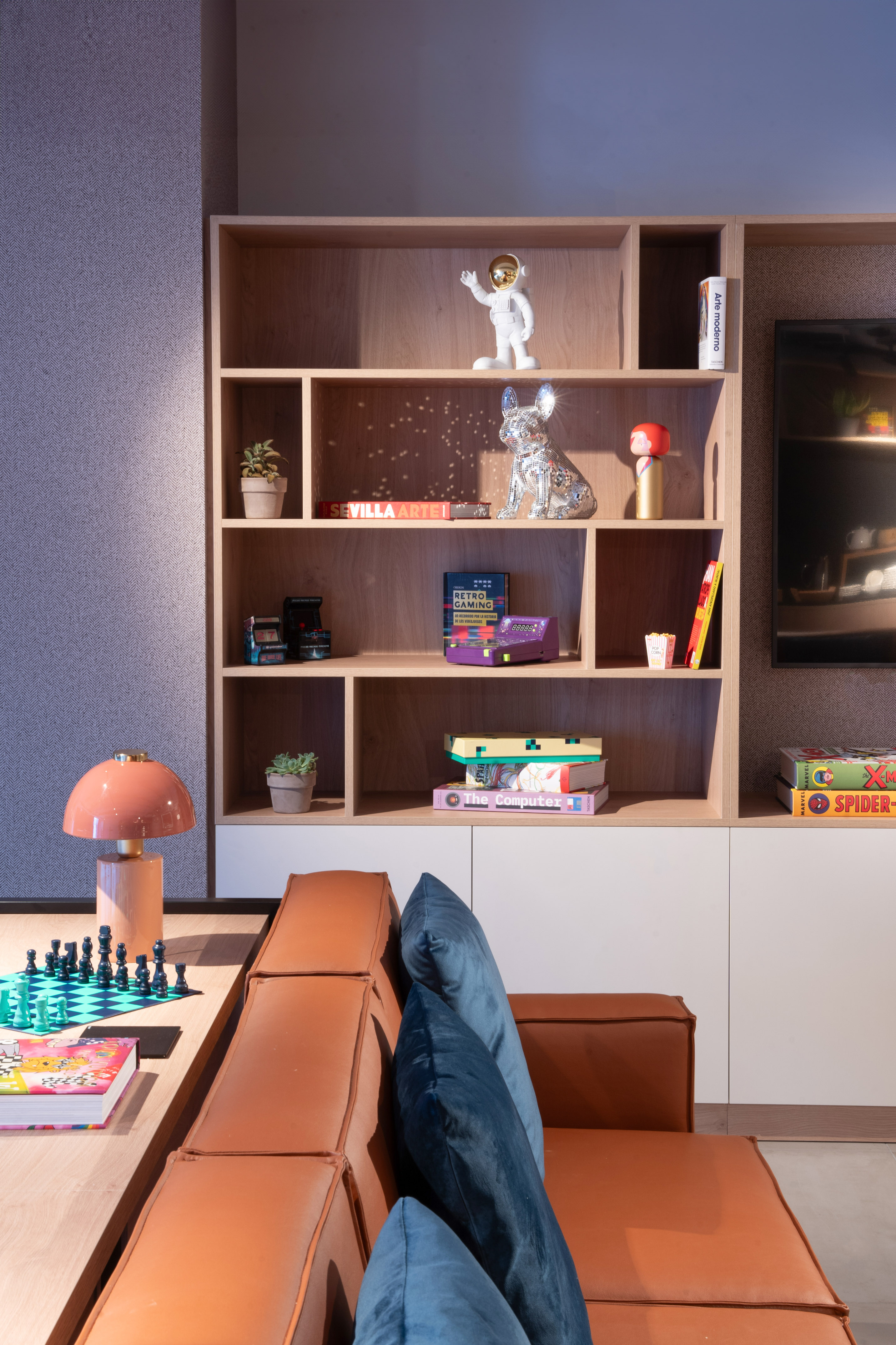 a room with a couch and a bookcase