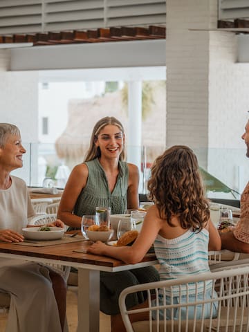 a group of people sitting at a table
