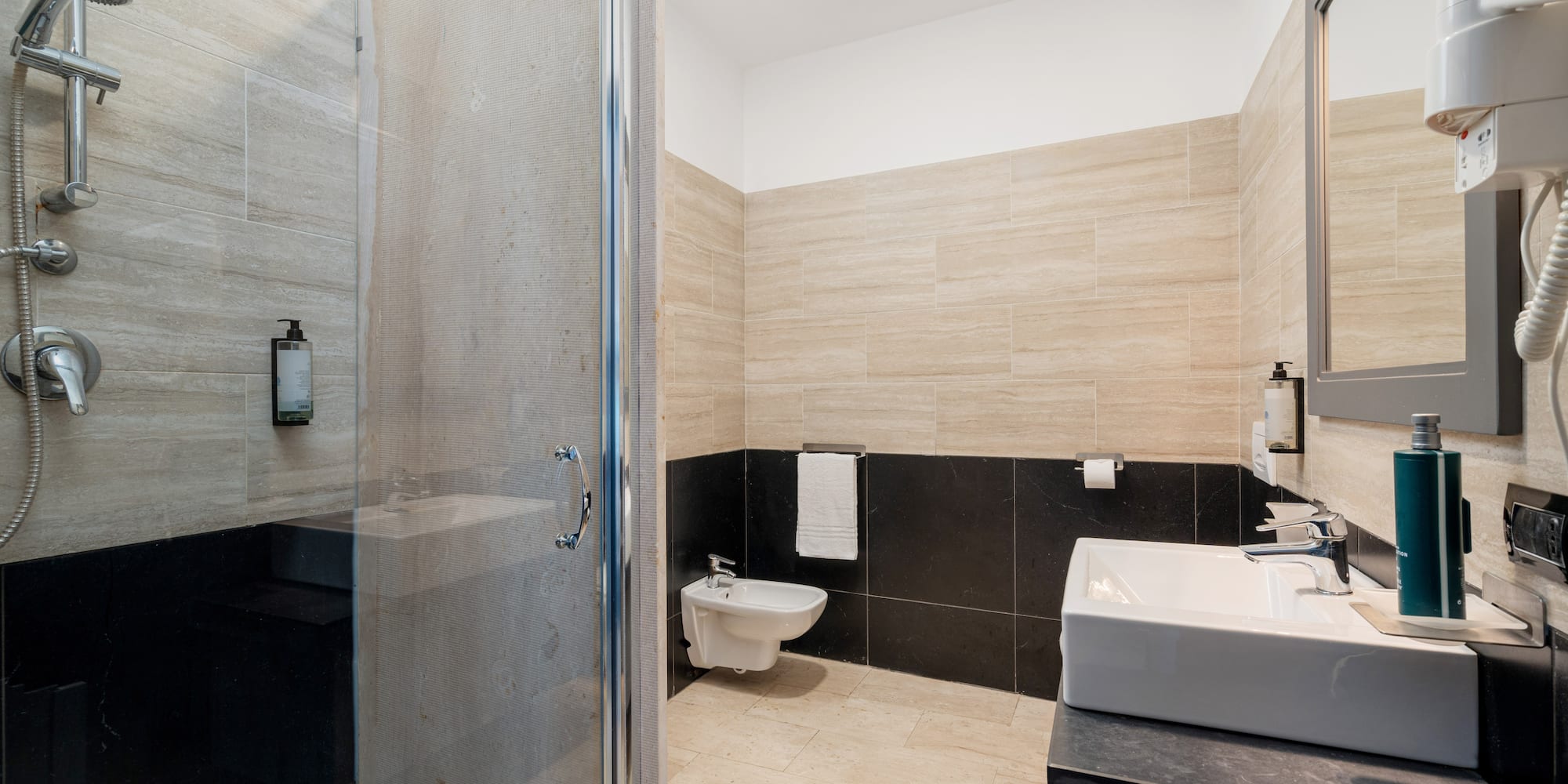 a bathroom with a shower and sink