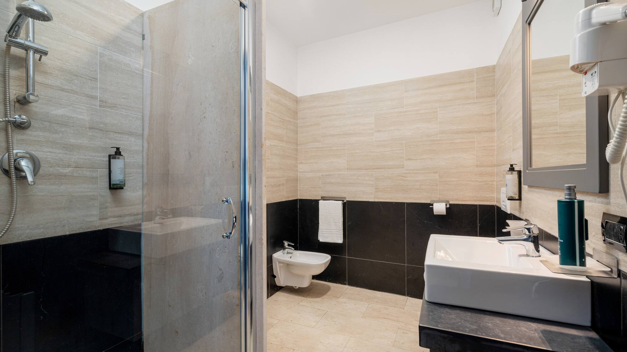 a bathroom with a shower and sink